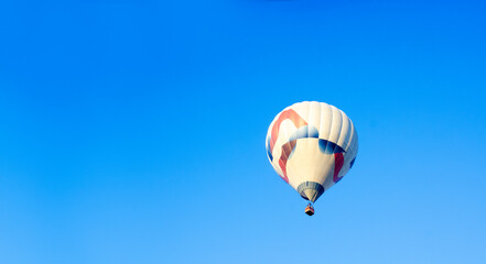 Hot air balloon in the sky. Balloon. Aeronautics. Blue sky.