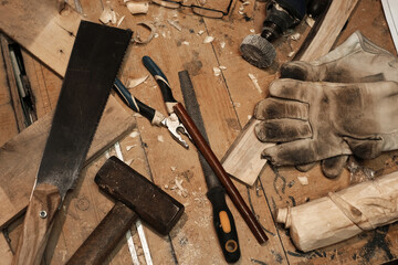 working tools for carving wood on the roofing top view. workshop of a man working with wooden...