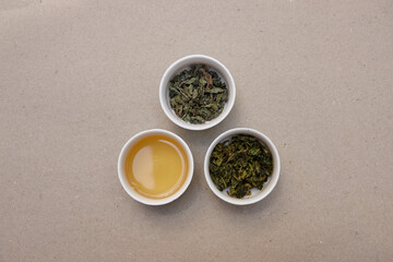 Tea leaves and drink on table