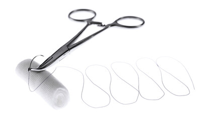 Forceps with suture thread and bandage roll on white background. Medical equipment