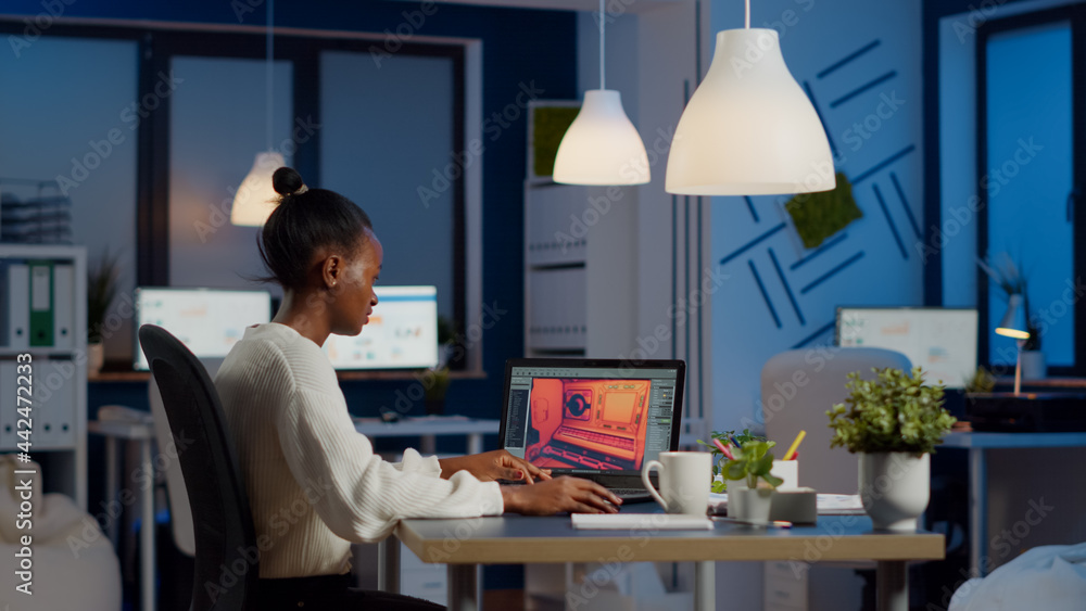 Poster dark skin gamer developer working at video game in midnight from business office using professional 