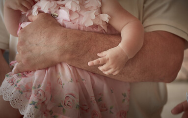 Close up baby in daddy's arms