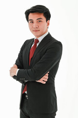 Obraz na płótnie Canvas Portrait of successful professional asian businessman in formal style black suit, red tie, white shirt, little smile, standing with crossed arms on white background, looking straight at the camera