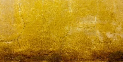 Cracked and dirty concrete wall texture. yellow-brown tone