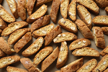 Traditional Italian almond biscuits (Cantucci) on parchment paper, top view