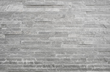 Natural quartzite stone bricks texture. White stone masonry wall background