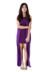 Charming ethnic female in long purple dress standing with crossed arms on white isolated background in studio and looking at camera.