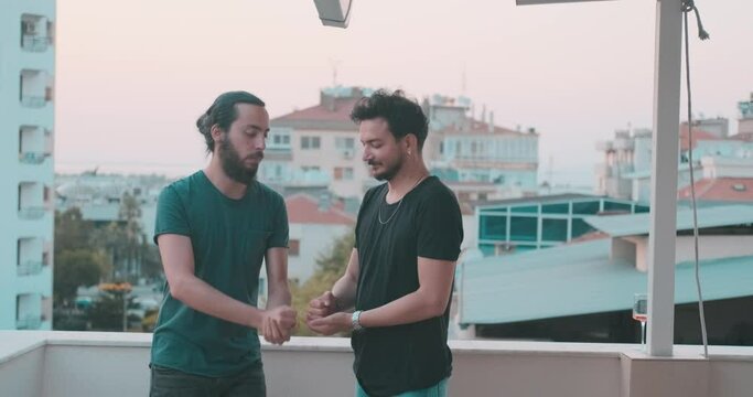 Young friends are rock paper scissors on holiday time. Cheerful friendship and game concept.