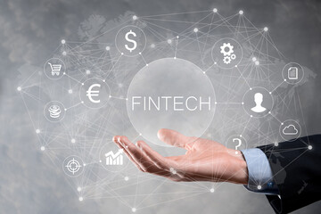 Businessman hold Fintech -financial technology concept.Business investment banking payment. Cryptocurrency investment and digital money. Business concept on virtual screen.