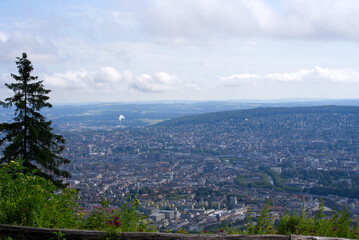 Panoramic view over City of Zurich seen from local mountain Uetliberg on a summer day. Photo taken June 29th, 2021, Zurich, Switzerland.