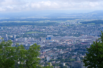 Panoramic view over City of Zurich seen from local mountain Uetliberg on a summer day. Photo taken June 29th, 2021, Zurich, Switzerland.