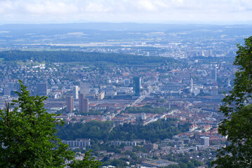 Panoramic view over City of Zurich seen from local mountain Uetliberg on a summer day. Photo taken June 29th, 2021, Zurich, Switzerland.