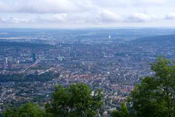 Panoramic view over City of Zurich seen from local mountain Uetliberg on a summer day. Photo taken June 29th, 2021, Zurich, Switzerland.