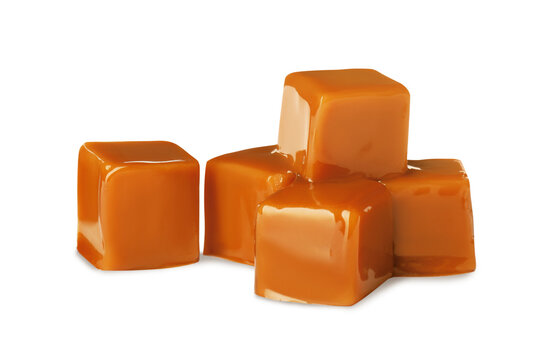 Heap of caramel candies on white background