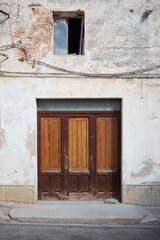 Fototapeta na wymiar dated house entrance of a village on the sea of western Sicily