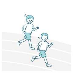 体育の授業で運動場を走る男子生徒たち