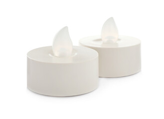 Decorative flameless LED candles on white background