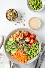 Buddha bowl, vegan balanced meal with beans, chickpeas and vegetables. Top view