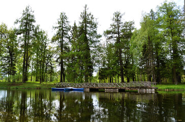 Fototapeta na wymiar Empty wooden boats on the lake, rural view