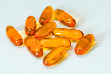 fish oil capsule on white background. Omega 3 rich.