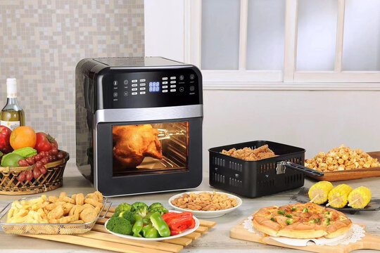 high technology electronic machines product black and white modern multifunctional air fryer in kitchen with many food background for house kitchen use