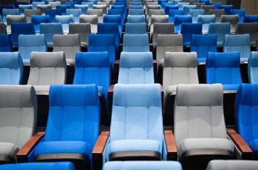 conference room with many blue and gray seats.