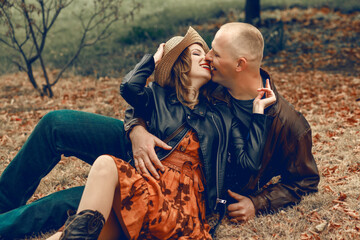 Young couple having fun in park. Happy romantic moments of a lovely couple fooling around in the...
