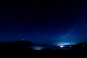 starry night sky with mountain