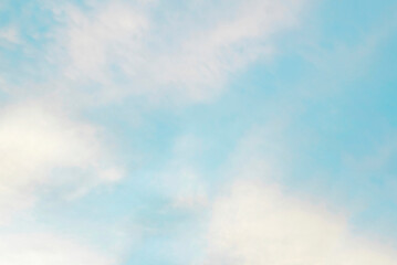 Blue sky and white clouds, abstract natural background on a bright sunny day. The concept of freedom, tourism, recreation, travel. Layout for design.