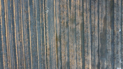 Fototapeta premium prepared potato field background in northern Norway during early springtime, aerial photo