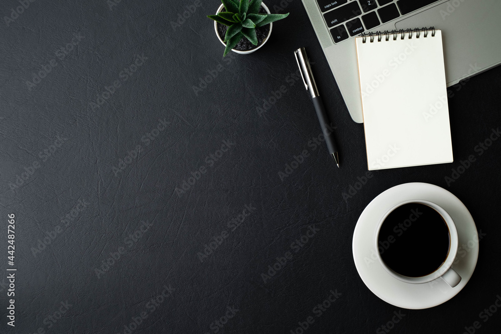 Aufkleber workplace in office with black leather office desk table. top view from above of keyboard laptop com