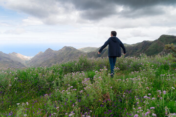 Young male hiker traveling in mountains