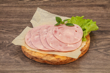 Slised ham snack over board