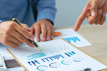 Close up account man hand using calculator for calculate and writing make a note with pen, ..financial reporting and business performance to check investment results