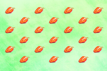 Pattern from strawberries on a colored background