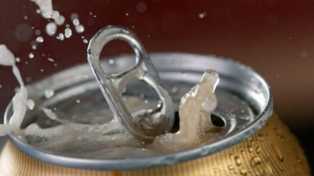 Freeze Motiion Of Opening A Can Of Beer. Macro Shot.