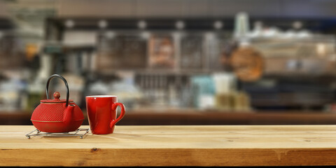 Wooden desk of free space and kettle with tea 