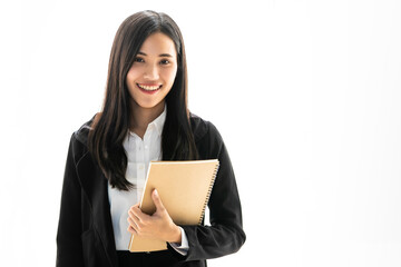 Beautiful Asian female secretary in black suit standing with smile face and self-confident in...
