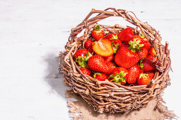 Fresh ripe strawberry in a wicker basket