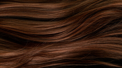 Macro shot of beautiful healthy long smooth flowing brown hair.