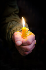 Memorial Candle in the Hand of the Ukraine Soldier.