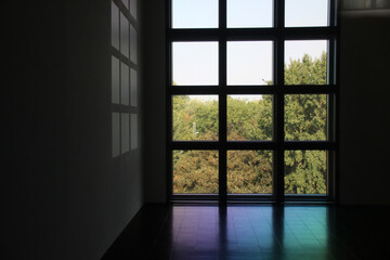 Minimalistic window in building. Modern architecture with nature. Trees in front of window.