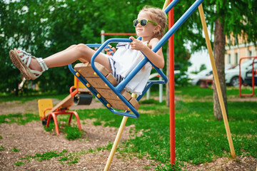 girl is swinging on swing