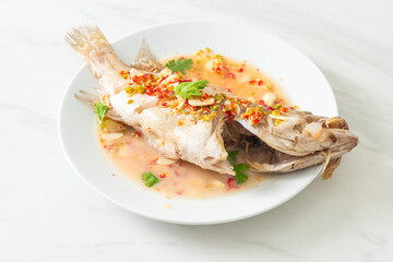 Steamed grouper fish with lime and chillies