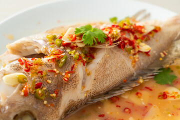 Steamed grouper fish with lime and chillies