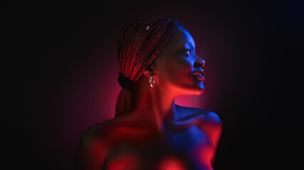 stylish afro girl portrait near pink blue neon light sign. Portrait in cool neon light.