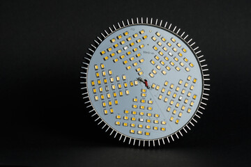 LED phytolamp for growing seedlings. Close-up, black background.