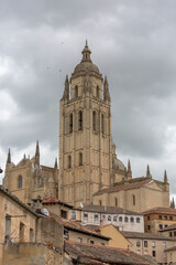 Fototapeta premium Majestic view at the iconic spanish gothic building at the Segovia cathedral, tower dome and surrounding buidings