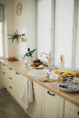 Interior of kitchen with ingredients for making lemonade on the table.