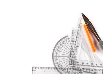 Plastic transparent rulers set with divider and graphite pencil isolated on white background, top...